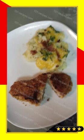 Breaded pork loin chops with a side of mashed potatoes topped with bacon, cheese, green onion recipe